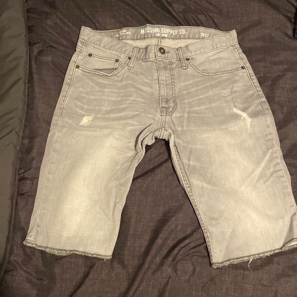 These are jean shorts from Mossimo Supply Co. The size is 32 waist.